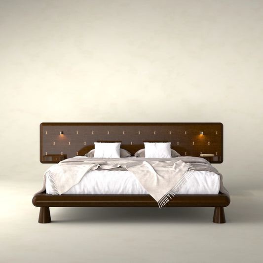 Front view of the Will Bed by Antony Gasnier with a wide inlaid headboard, integrated tables and reading lights