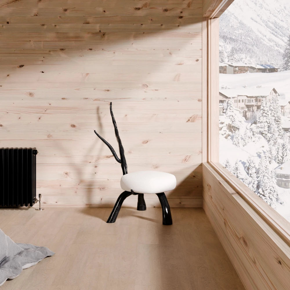Winter Branch Chair by Antony Gasnier displayed in a wood-lined alpine interior overlooking snowy mountains