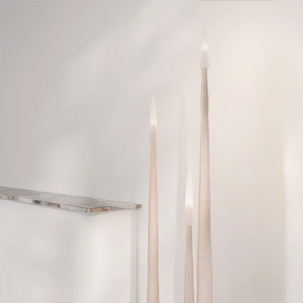 Three Winter Candle holders in light wood by Antony Gasnier, displayed in a bright contemporary interior