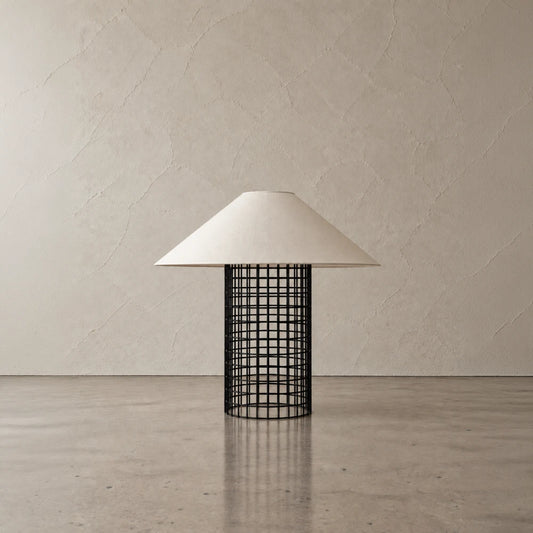 Black Ento Table Lamp by Garnier Pingree, with an open cylindrical metal grid base and a wide cream conical shade.