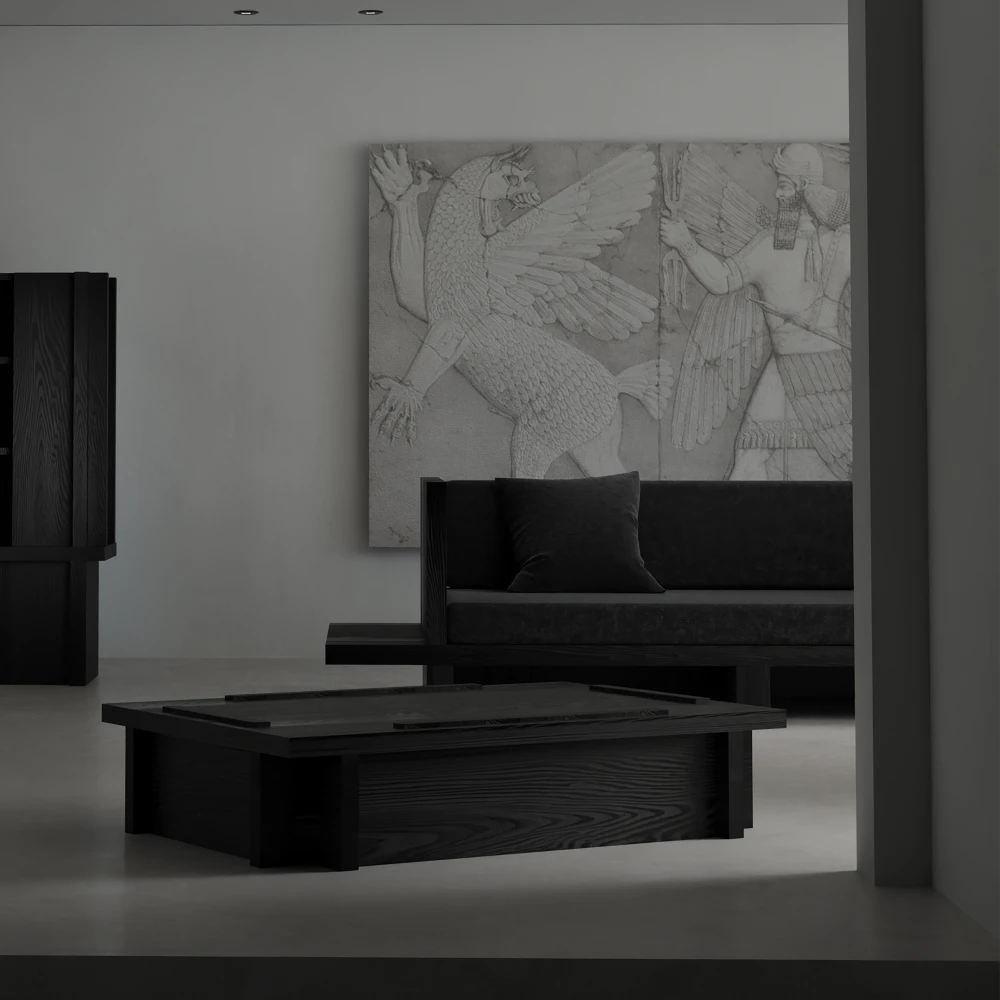 Front view of the Itooraba Sofa by Sizar Alexis displayed behind a matching coffee table in a monochromatic architectural interior.