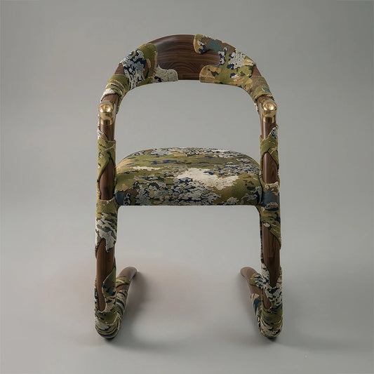 Straight view of the Jardin Dining Armchair by Studio Romell, highlighting its bronze ferrules, walnut frame and Eden Algues upholstery.