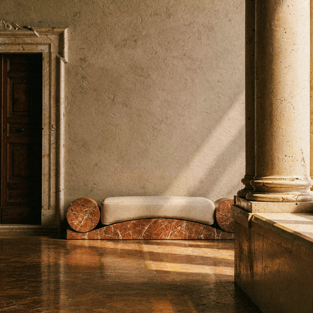 AM-03 bench in Rosso Levanto marble and off-white linen by AMARE EDITIONS, styled in a classical interior