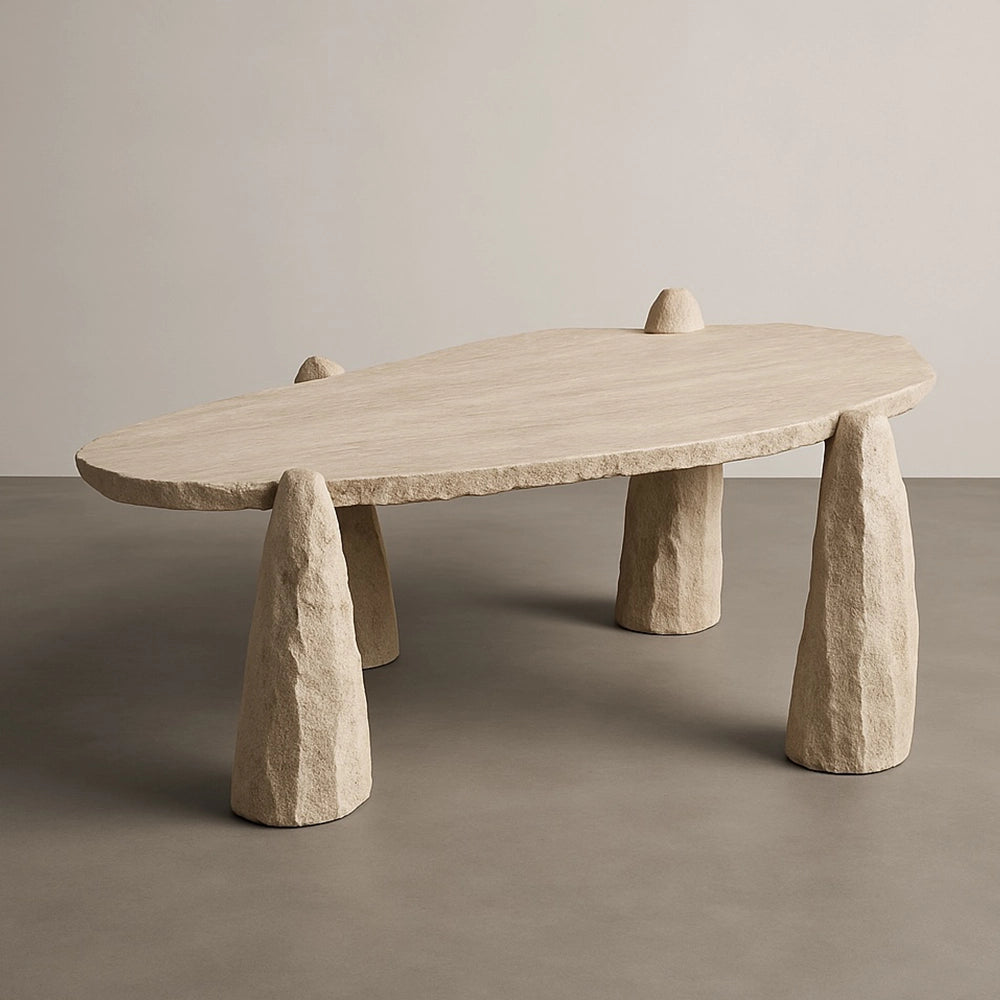 Arx travertine dining table by Andres Monnier with an irregular slab and multiple tapered stone legs.