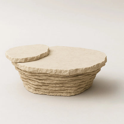 Aeon travertine coffee table by Andres Monnier with an organic top and stacked, irregular stone base.