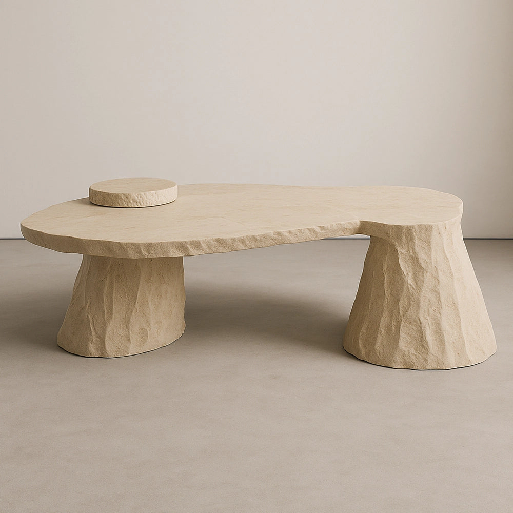 Cenote travertine dining table by Andres Monnier with an organic top, flared bases and raised stone disc.