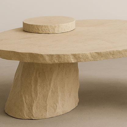 Close-up of the raised circular element and travertine surface of the Cenote Dining Table.