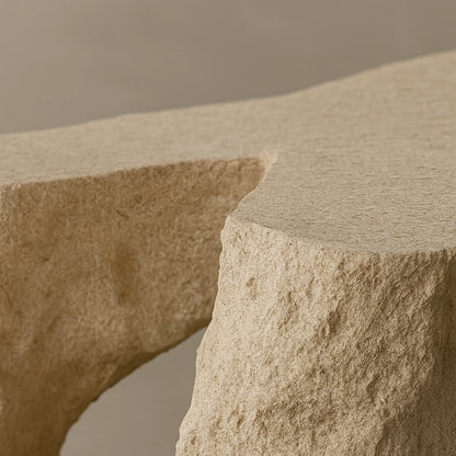 Close-up of the rough travertine surface and carved leg opening of the Davido Coffee Table.