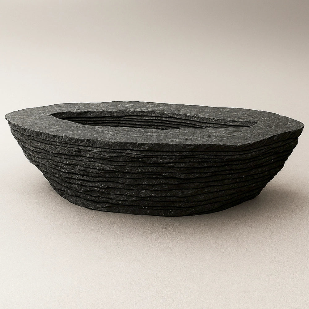 Einros black marble coffee table by Andres Monnier with layered circular forms around a central void.