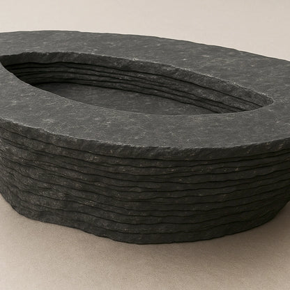 Close-up of the central opening and layered black marble texture of the Einros Coffee Table.