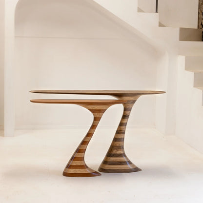 Small and large Flip consoles by Antoine Maurice nested together, comparing their sculpted striped wooden bases