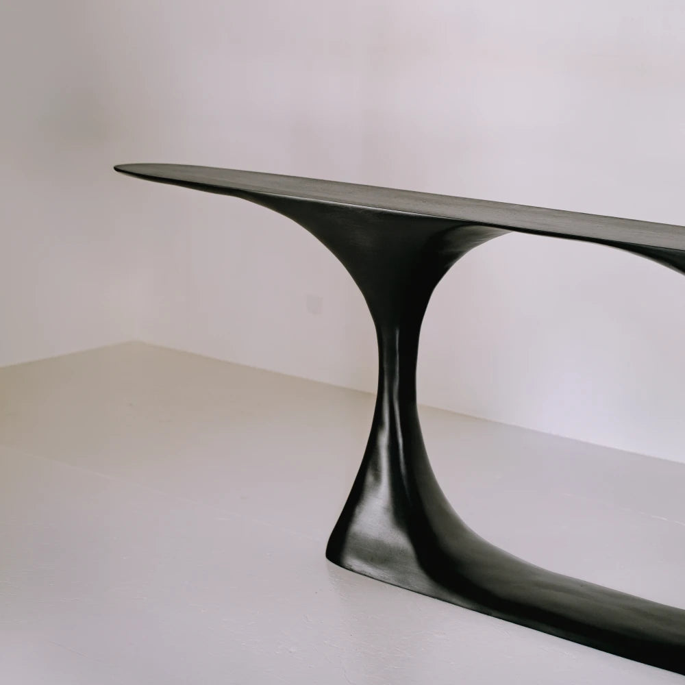 Detail of the Invitation console by Antoine Maurice, showing its slender top meeting a narrow curved support