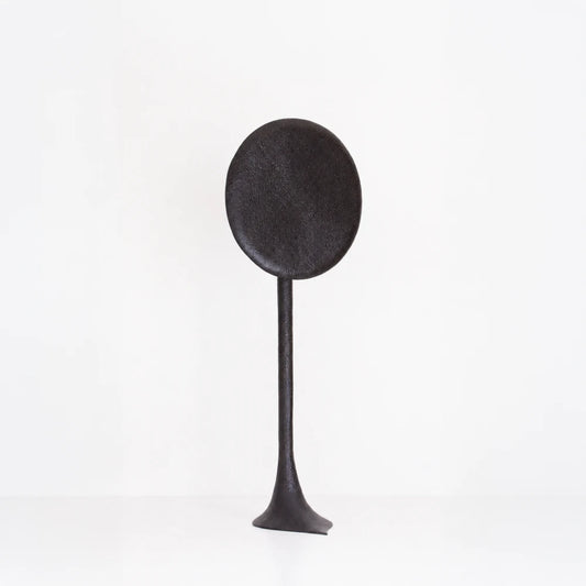 Solis floor lamp handcrafted in textured walnut by Antoine Maurice, with a tall stem and large dark oval disc