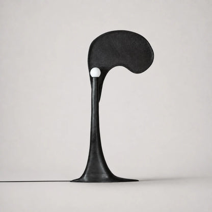 Spectre floor lamp hand-carved in high-gloss black solid oak by Antoine Maurice, with a white spherical light