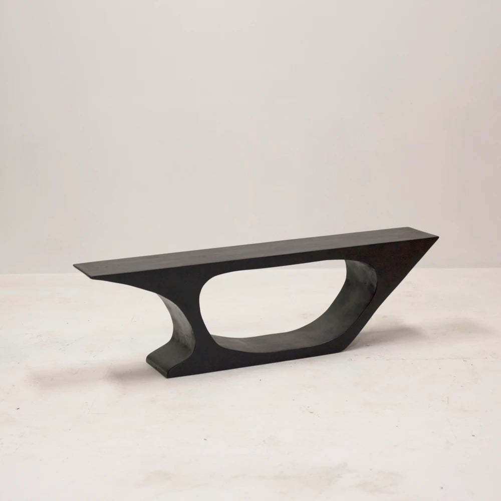 Three-quarter view of the BC03 bench by Antoine Maurice with a straight seat and sculpted open beech base