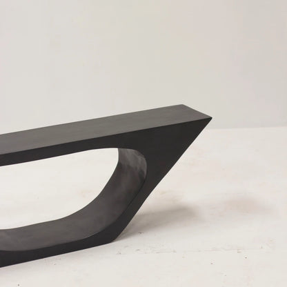 Close-up of the tapered end and curved inner opening of the hand-carved BC03 beech bench