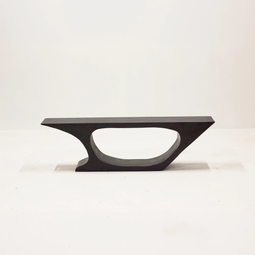 BC03 bench in stained and waxed carved beech by Antoine Maurice, front view showing its asymmetrical hollowed base