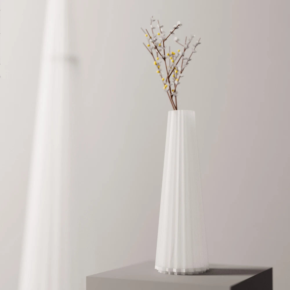 Frosted white Alta Vase by Antony Gasnier displayed on a pedestal with a delicate flowering branch