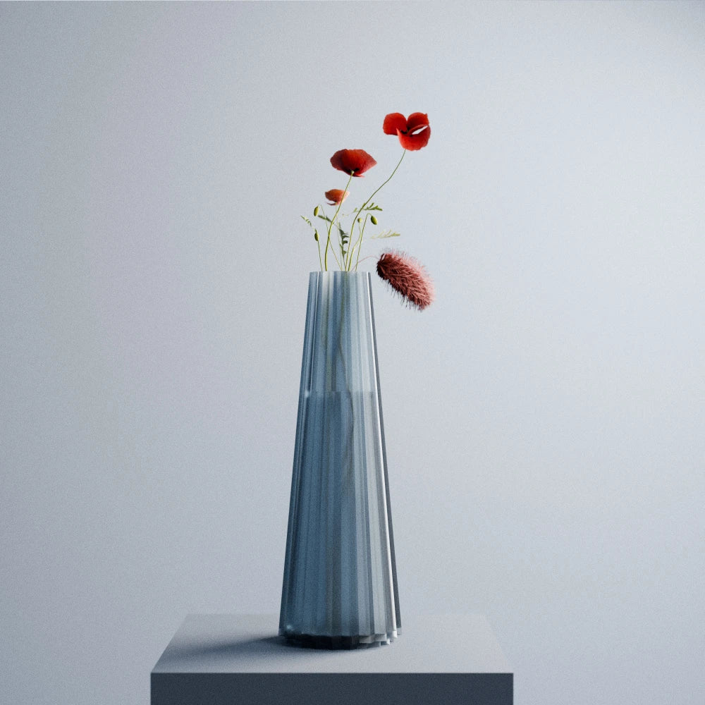 Blue-grey Alta Vase by Antony Gasnier displayed on a pedestal with red poppies and delicate foliage
