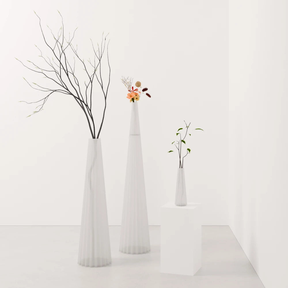Three frosted white Alta Vases by Antony Gasnier in different sizes with flowers, branches and foliage