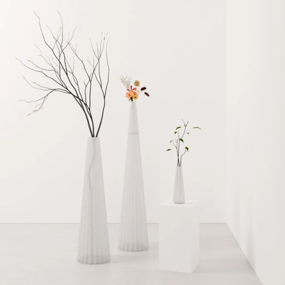 Three frosted white Alta Vases by Antony Gasnier in different sizes with flowers, branches and foliage