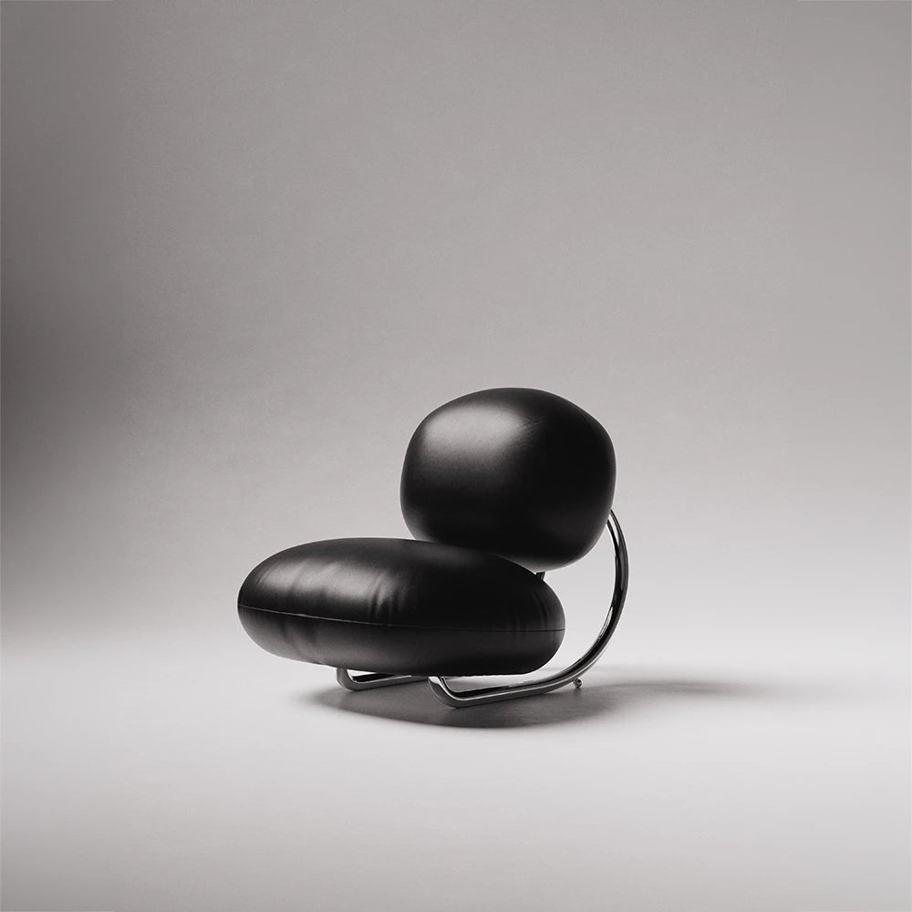 C8 Armchair in black leather and polished chrome by Antony Gasnier, shown from a three-quarter front view