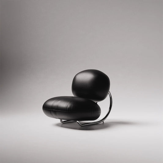 C8 Armchair in black leather and polished chrome by Antony Gasnier, shown from a three-quarter front view