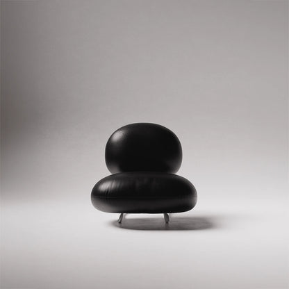 Front view of the C8 Armchair by Antony Gasnier with rounded black leather seat and back cushions