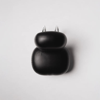 High-angle view of the C8 Armchair by Antony Gasnier showing its black leather upholstery and curved chrome structure