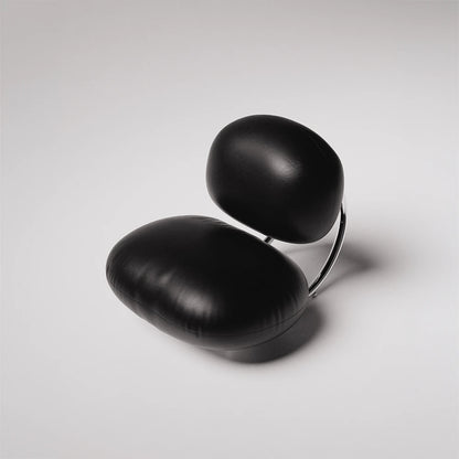 Top view of the C8 Armchair by Antony Gasnier with two rounded black leather cushions and polished chrome supports