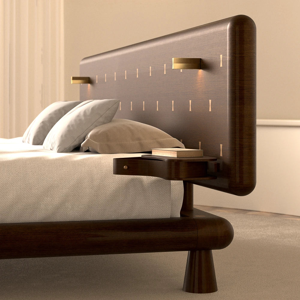Side detail of the Will Bed by Antony Gasnier showing its rounded wood frame, headboard, reading light and integrated table