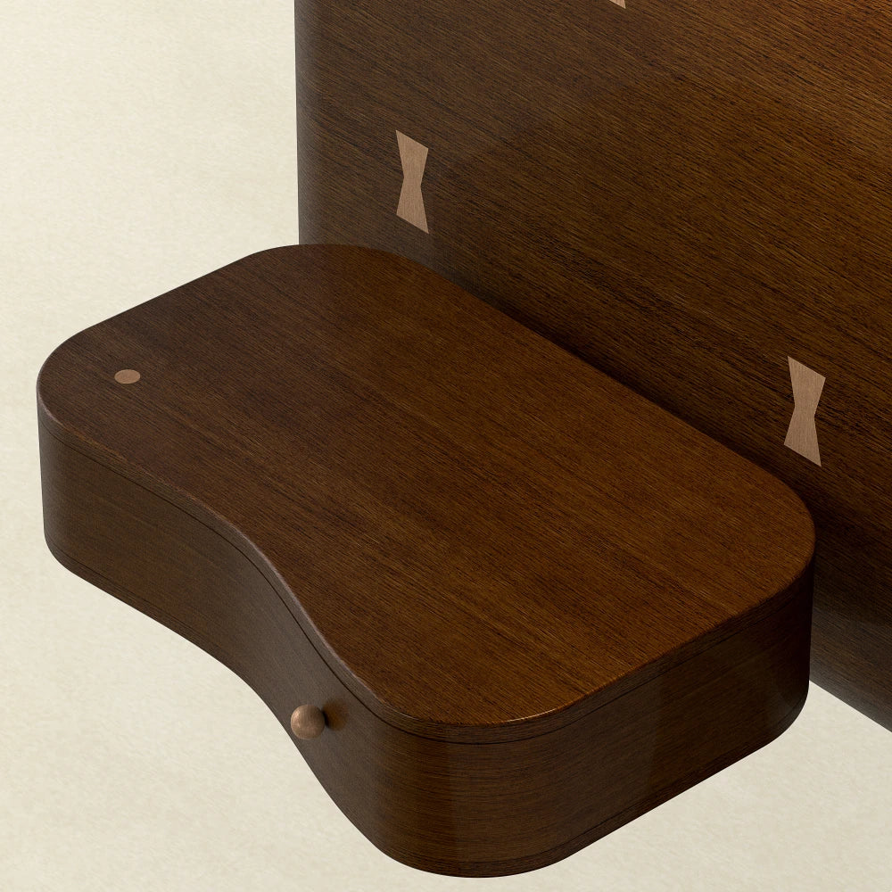 Close-up of the integrated bedside table and pale bow-tie inlays on the dark wood headboard of the Will Bed by Antony Gasnier