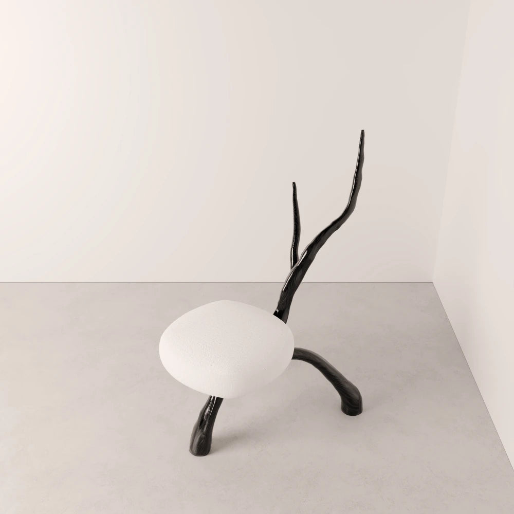 High-angle view of the Winter Branch Chair by Antony Gasnier, showing its rounded white seat and branching dark oak frame