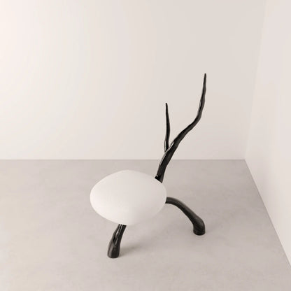 High-angle view of the Winter Branch Chair by Antony Gasnier, showing its rounded white seat and branching dark oak frame
