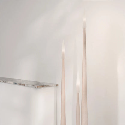 Three Winter Candle holders in light wood by Antony Gasnier, displayed in a bright contemporary interior