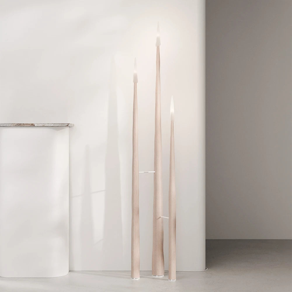 Front view of three Winter Candle holders in light wood by Antony Gasnier at varying heights