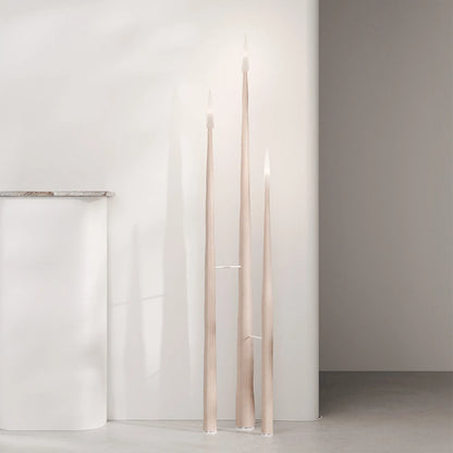 Front view of three Winter Candle holders in light wood by Antony Gasnier at varying heights