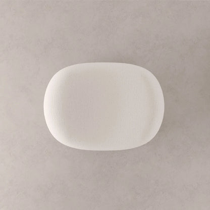 Top view of the Winter Ottoman by Antony Gasnier, highlighting the softly hollowed centre of its white upholstered seat