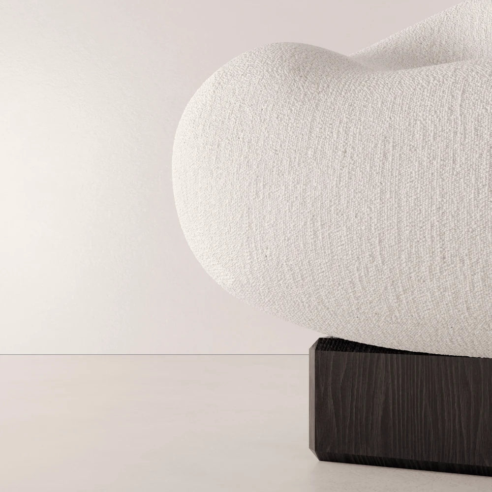 Close-up of the textured white fabric and dark solid oak base of the Winter Powder Chair by Antony Gasnier