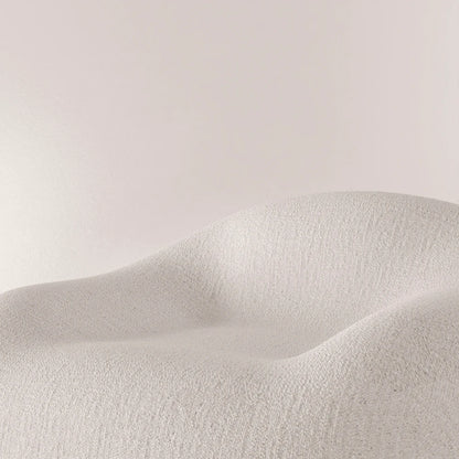 Close-up of the curved seat and textured white upholstery of the Winter Powder Chair by Antony Gasnier