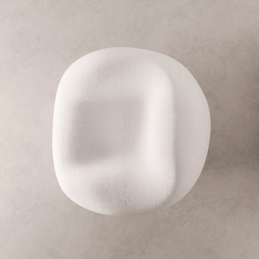 High-angle view of the Winter Powder Chair by Antony Gasnier, showing its sculpted seat and enveloping curved form