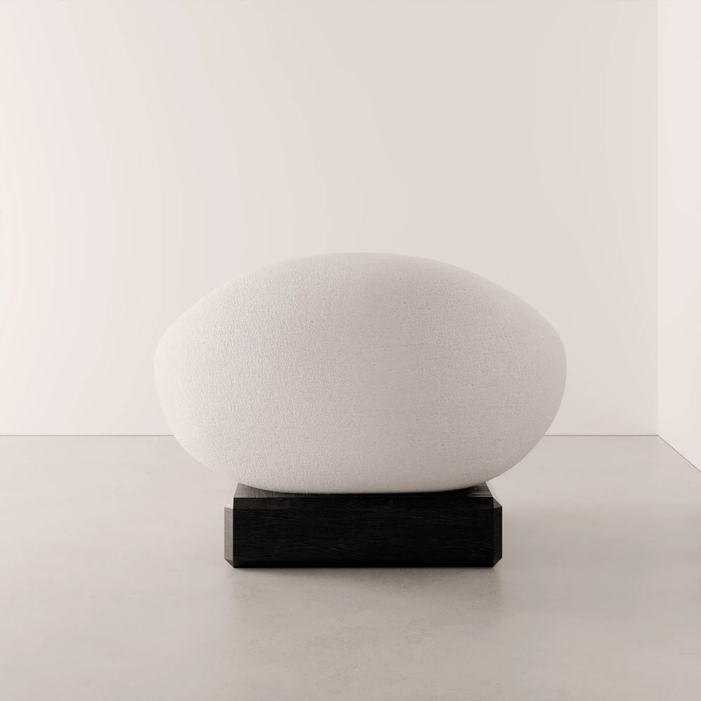 Rear view of the Winter Powder Chair by Antony Gasnier with a rounded white upholstered back and dark oak base
