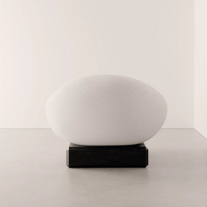 Rear view of the Winter Powder Chair by Antony Gasnier with a rounded white upholstered back and dark oak base