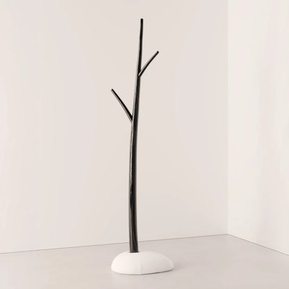 Winter Tree coat stand in dark wood by Antony Gasnier with three branches and a rounded white upholstered base