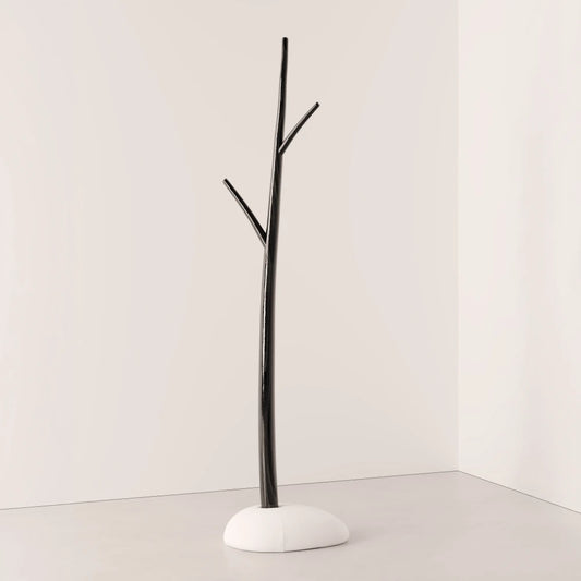 Winter Tree coat stand in dark wood by Antony Gasnier with three branches and a rounded white upholstered base