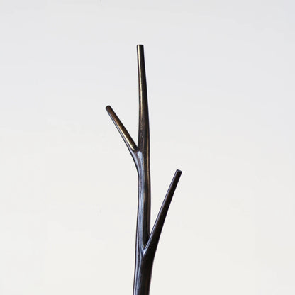 Upper detail of the Winter Tree coat stand by Antony Gasnier showing its three tapered dark wood branches