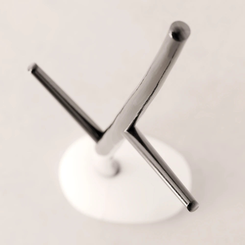 High-angle view of the branching dark wood structure and white base of the Winter Tree coat stand by Antony Gasnier