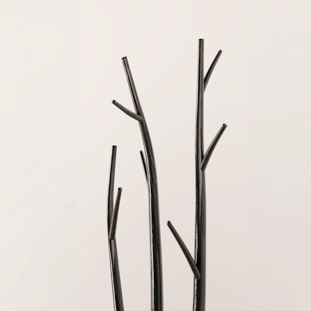 Upper detail of the Winter Tree Coats Triple by Antony Gasnier, featuring three dark wood trunks with sculptural branch hooks.