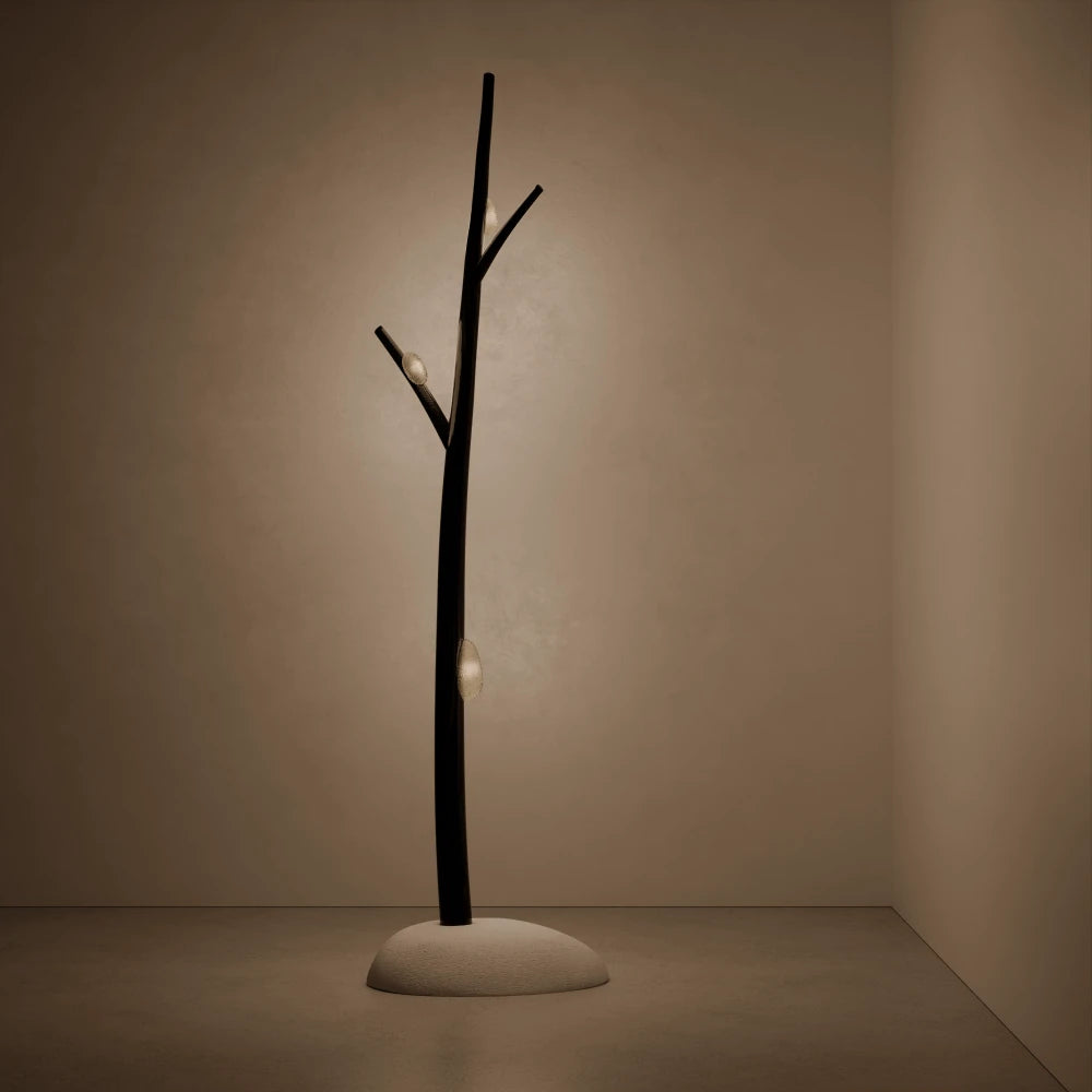 Winter Tree Light floor lamp by Antony Gasnier illuminated, casting a soft warm glow from its textured glass diffusers.