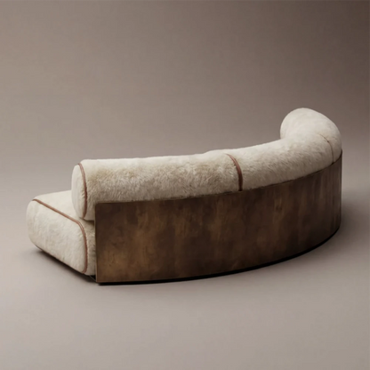 Rear view of the Étreinte sofa by Diamant Versatile, highlighting its sweeping curved metal structure and upholstered backrest.